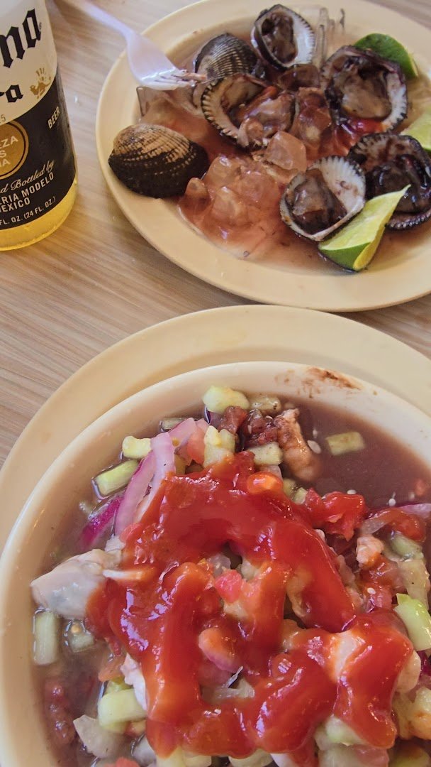 Bright mariscos dishes served family-style.