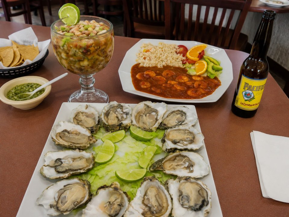 Colorful seafood spread in a relaxed restaurant.