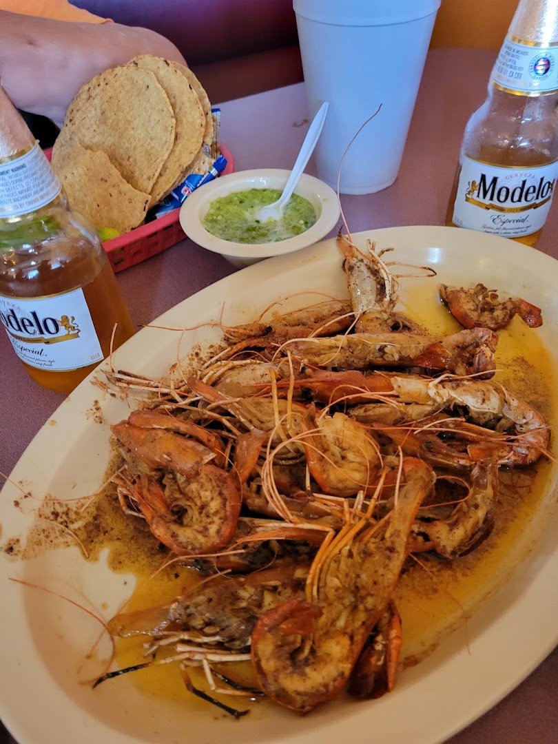 Colorful seafood spread in a relaxed restaurant.